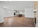 Spacious open-concept living area with kitchen, fireplace, and hardwood flooring at 2176 Millennium Dr # 093, Lancaster, SC 29720