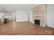 Open-concept living area with kitchen, fireplace, and hardwood flooring at 2176 Millennium Dr # 093, Lancaster, SC 29720