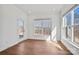 Bright room featuring hardwood floors, white trim, and two large windows at 2176 Millennium Dr # 093, Lancaster, SC 29720