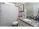 Bathroom featuring granite countertops, framed mirror, a shower with curtains, and a white toilet at 2205 Philadelphia Church Rd, Dallas, NC 28034