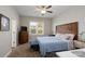 Cozy bedroom with a ceiling fan, window, stylish furnishings, and comfortable carpet at 2205 Philadelphia Church Rd, Dallas, NC 28034
