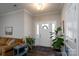 Inviting entryway features a bright white front door, wood-look flooring, and neutral paint colors at 2205 Philadelphia Church Rd, Dallas, NC 28034