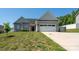 Inviting home featuring a two-car garage, vinyl siding, and a well-manicured front yard at 2205 Philadelphia Church Rd, Dallas, NC 28034