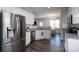 Modern kitchen with stainless steel appliances, granite countertops, and wooden floors at 2205 Philadelphia Church Rd, Dallas, NC 28034