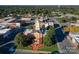 Aerial view of a red brick courthouse surrounded by lush trees and buildings in downtown at 2512 Mabel Ln, Monroe, NC 28110