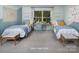 Shared ' bedroom featuring two twin beds, a desk, and playful decor at 2512 Mabel Ln, Monroe, NC 28110