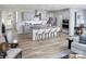 Spacious eat-in kitchen boasts gray cabinets, a center island, modern appliances, and an open-concept design at 2512 Mabel Ln, Monroe, NC 28110
