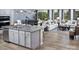 Stylish kitchen island overlooks a dining area and living room, creating an inviting space for entertaining at 2512 Mabel Ln, Monroe, NC 28110