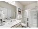 Clean bathroom with a white single vanity, toilet and glass enclosed shower at 2526 Mabel Ln, Monroe, NC 28110