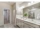 Bright bathroom with double vanity, modern lighting, and glass-enclosed shower at 2526 Mabel Ln, Monroe, NC 28110