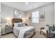 Cozy bedroom featuring neutral decor, a soft bed, and natural light from the window at 2526 Mabel Ln, Monroe, NC 28110