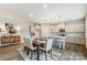 Inviting dining area adjacent to kitchen with stylish light fixtures and modern decor at 2526 Mabel Ln, Monroe, NC 28110