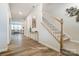 Inviting entryway with wood flooring, a staircase, and decor that complements the home's style at 2526 Mabel Ln, Monroe, NC 28110