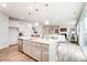 Spacious open concept kitchen featuring a large island with modern lighting and stainless steel appliances at 2526 Mabel Ln, Monroe, NC 28110