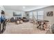 Bright living room with large sectional sofa, stylish decor, and lots of natural light from large windows at 2526 Mabel Ln, Monroe, NC 28110