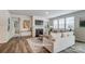 Sunlit living area featuring hardwood floors, a fireplace, and comfortable seating at 2526 Mabel Ln, Monroe, NC 28110