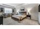 This spacious main bedroom features tray ceilings and lots of natural light at 2526 Mabel Ln, Monroe, NC 28110