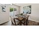 This dining area has a wooden table, seating for six, and sliding glass doors to the yard at 2905 Penninger Cir, Charlotte, NC 28262