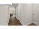 Inviting hallway showcases beautiful hardwood floors and leads to a cozy living area at 2905 Penninger Cir, Charlotte, NC 28262