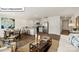 Open-concept living space with stainless steel appliances, modern furniture, and a dining area at 2905 Penninger Cir, Charlotte, NC 28262