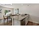Modern kitchen with stainless steel dishwasher and sink featuring granite countertops, adjoining dining area at 2909 Penninger Cir, Charlotte, NC 28262