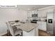 Modern kitchen featuring granite countertops, stainless steel appliances, an island and gray cabinets at 2917 Penninger Cir, Charlotte, NC 28262