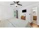 Bright bedroom with a ceiling fan, window, and a door to the bathroom at 2933 Hilliard Dr, Charlotte, NC 28205