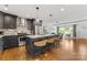 The kitchen showcases an island with barstool seating open to the dining and living areas at 2933 Hilliard Dr, Charlotte, NC 28205