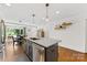 The kitchen island features a stainless steel dishwasher and granite countertops at 2933 Hilliard Dr, Charlotte, NC 28205