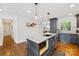 The kitchen shows an island with barstool seating and stainless steel appliances at 2933 Hilliard Dr, Charlotte, NC 28205