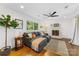 The living room has a white brick fireplace and a comfortable sectional couch at 2933 Hilliard Dr, Charlotte, NC 28205