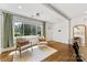 Bright living area with hardwood floors, comfortable seating, and large windows overlooking the outdoors at 2933 Hilliard Dr, Charlotte, NC 28205