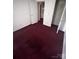Bedroom featuring red carpeting and closet at 321 Jennings Rd, Statesville, NC 28625