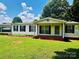 Charming single-story home with a well-maintained lawn and inviting front porch at 321 Jennings Rd, Statesville, NC 28625
