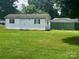 Exterior view of a white storage shed in the backyard at 321 Jennings Rd, Statesville, NC 28625