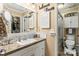 Charming bathroom with a classic vanity, decorative mirror, and a well-lit space, exuding comfort and style at 372 Northwest Dr, Davidson, NC 28036