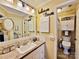 Bathroom with a decorative mirror, 'believe' decor and a cabinet above the toilet, providing ample storage at 372 Northwest Dr, Davidson, NC 28036