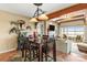 Inviting dining area with wooden table and chairs, stylish lighting, and seamless flow to the living space and outdoor view at 372 Northwest Dr, Davidson, NC 28036