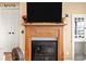 Close up of a charming fireplace with mantel and hearth details at 372 Northwest Dr, Davidson, NC 28036