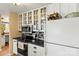 Well-equipped kitchen boasting white cabinetry, modern appliances, and ample countertop space for culinary endeavors at 372 Northwest Dr, Davidson, NC 28036