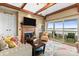 Inviting living room with lake views, a fireplace, and comfortable seating at 372 Northwest Dr, Davidson, NC 28036