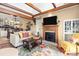 Open-concept living room featuring a fireplace and views of the kitchen and lake at 372 Northwest Dr, Davidson, NC 28036