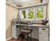 Well-lit office space with a cozy desk, white cabinets, and bright natural light at 372 Northwest Dr, Davidson, NC 28036