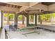Interior of a community pavilion with picnic tables, seating, and views of the surrounding greenery at 372 Northwest Dr, Davidson, NC 28036