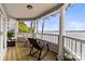 Enjoy stunning lake views from this spacious porch with rocking chairs at 372 Northwest Dr, Davidson, NC 28036