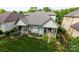 Aerial view of the home shows the landscaped backyard with dual patios at 4122 Banfield Pl, Charlotte, NC 28226
