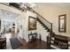 Inviting foyer featuring beautiful hardwood floors, staircase, and a decorative chandelier at 4122 Banfield Pl, Charlotte, NC 28226