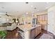 Open kitchen with large center island, stainless appliances, and seamless flow to the living spaces at 4122 Banfield Pl, Charlotte, NC 28226