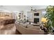 Spacious living room featuring hardwood floors, fireplace, and abundant natural light at 4122 Banfield Pl, Charlotte, NC 28226