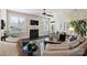 Living room featuring hardwood floors, fireplace, and plantation shutters at 4122 Banfield Pl, Charlotte, NC 28226